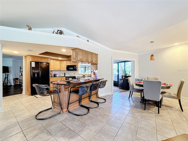 kitchen featuring ornamental molding, black appliances, hanging light fixtures, and light tile patterned floors