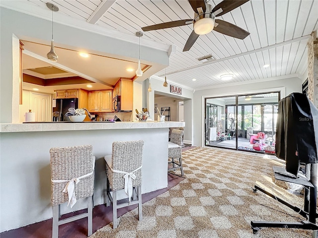 kitchen with black appliances, kitchen peninsula, ornamental molding, a breakfast bar, and light brown cabinets