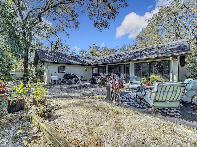 rear view of house with a patio