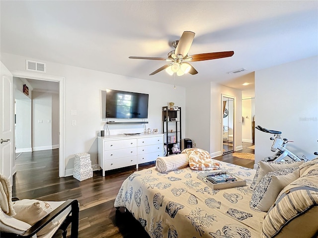 bedroom with dark wood-type flooring and ceiling fan