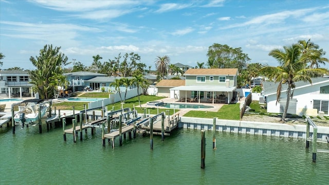 7886 9th Ave S, Saint Petersburg, FL 33707 - dock area featuring an outdoor pool, a water view, a patio area, and a residential view