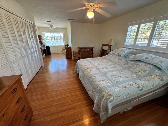 7886 9th Ave S, Saint Petersburg, FL 33707 - bedroom featuring wood finished floors, ceiling fan, and a closet