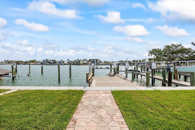 7886 9th Ave S, Saint Petersburg, FL 33707 - dock with boat lift, a yard, and a water view