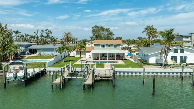 7886 9th Ave S, Saint Petersburg, FL 33707 - dock with boat lift, an outdoor pool, a water view, a patio, and a residential view