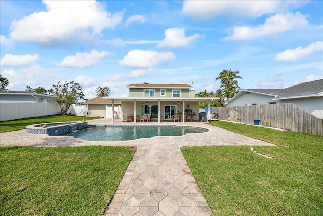 7886 9th Ave S, Saint Petersburg, FL 33707 - rear view of house with ceiling fan, a pool with connected hot tub, a patio, and stucco siding