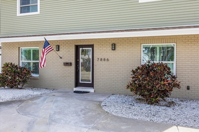 7886 9th Ave S, Saint Petersburg, FL 33707 - entrance to property featuring brick siding