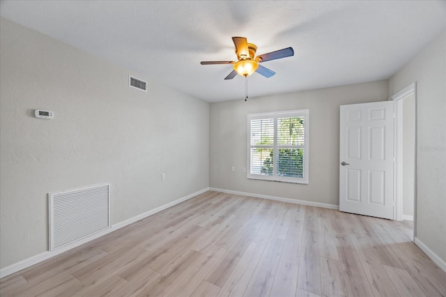 7886 9th Ave S, Saint Petersburg, FL 33707 - empty room featuring ceiling fan, light wood finished floors, and baseboards