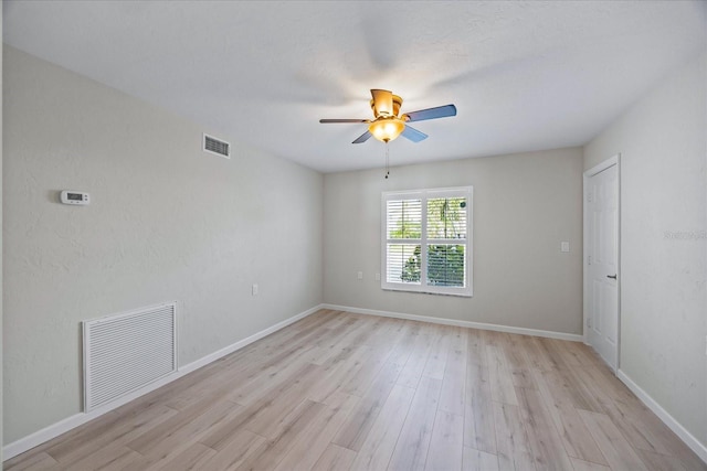 7886 9th Ave S, Saint Petersburg, FL 33707 - spare room with ceiling fan, light wood finished floors, and baseboards