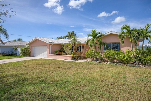 ranch-style home with a front lawn and a garage