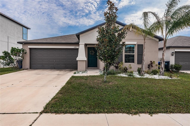 ranch-style house featuring a front yard and a garage