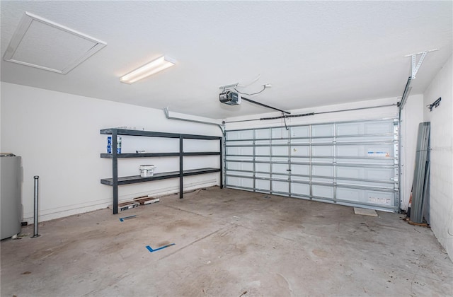 garage with a garage door opener and water heater