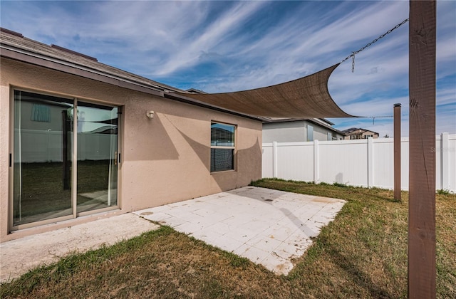 view of patio featuring fence