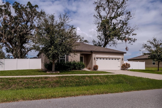 view of front of house with a front lawn and a garage