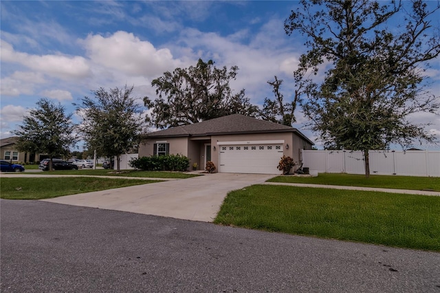 single story home featuring a front yard and a garage