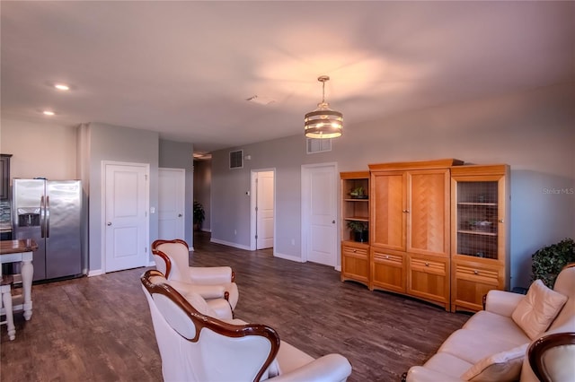 living room with dark hardwood / wood-style floors