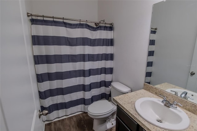 bathroom featuring toilet, a shower with curtain, vanity, and wood-type flooring