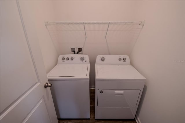 clothes washing area featuring washer and dryer