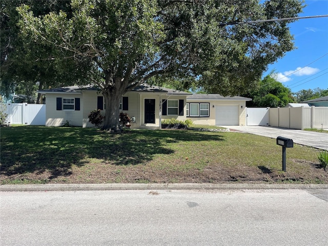 view of front of property featuring a front lawn and a garage