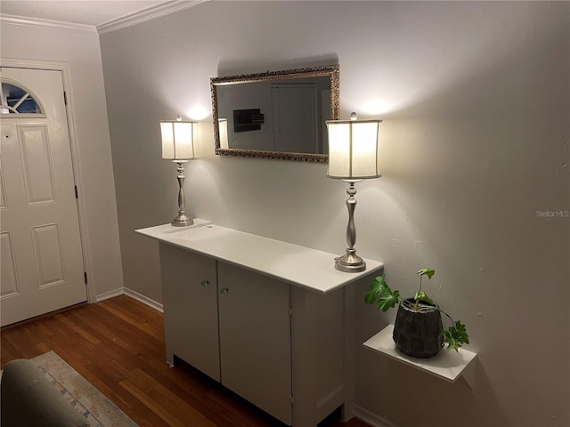 interior space featuring dark hardwood / wood-style flooring and crown molding