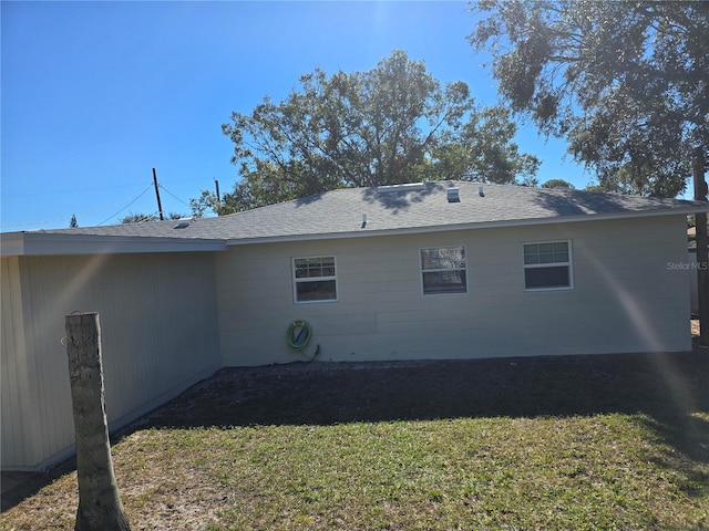 view of side of home featuring a lawn