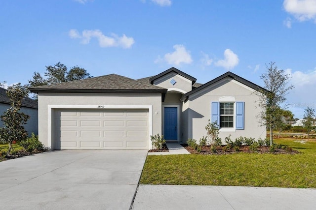 ranch-style home featuring a garage and a front yard