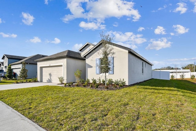 view of front of home with a garage and a front lawn