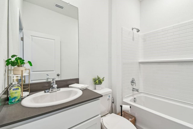 full bathroom featuring shower / tub combination, vanity, and toilet