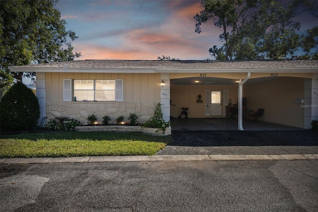 ranch-style home with a carport