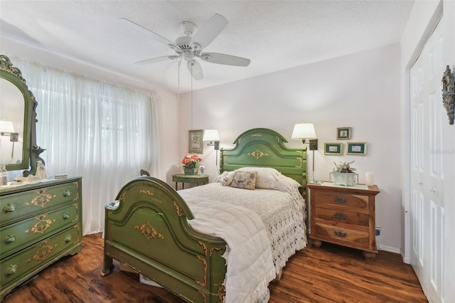 bedroom featuring dark hardwood / wood-style flooring, a textured ceiling, a closet, and ceiling fan