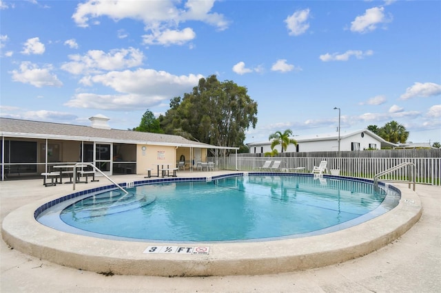 view of swimming pool featuring a patio area