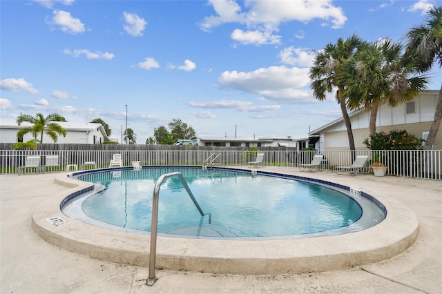 view of swimming pool with a patio area