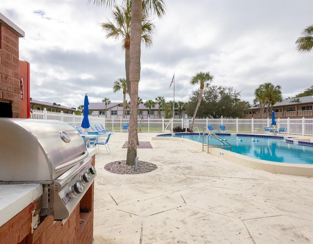 650 Pinellas Point Dr S Unit 211, Saint Petersburg, FL 33705 - community pool featuring a patio and a grill