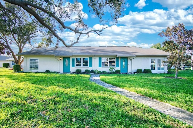 ranch-style house featuring a front lawn