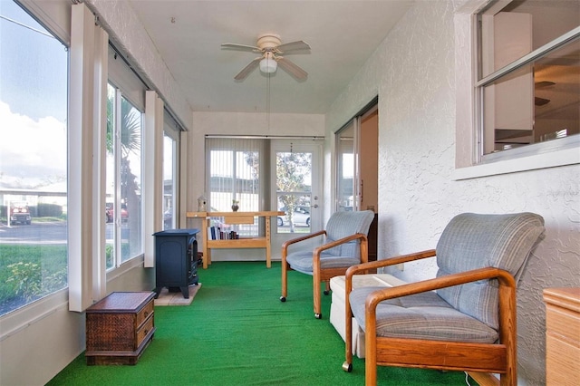 sunroom with ceiling fan