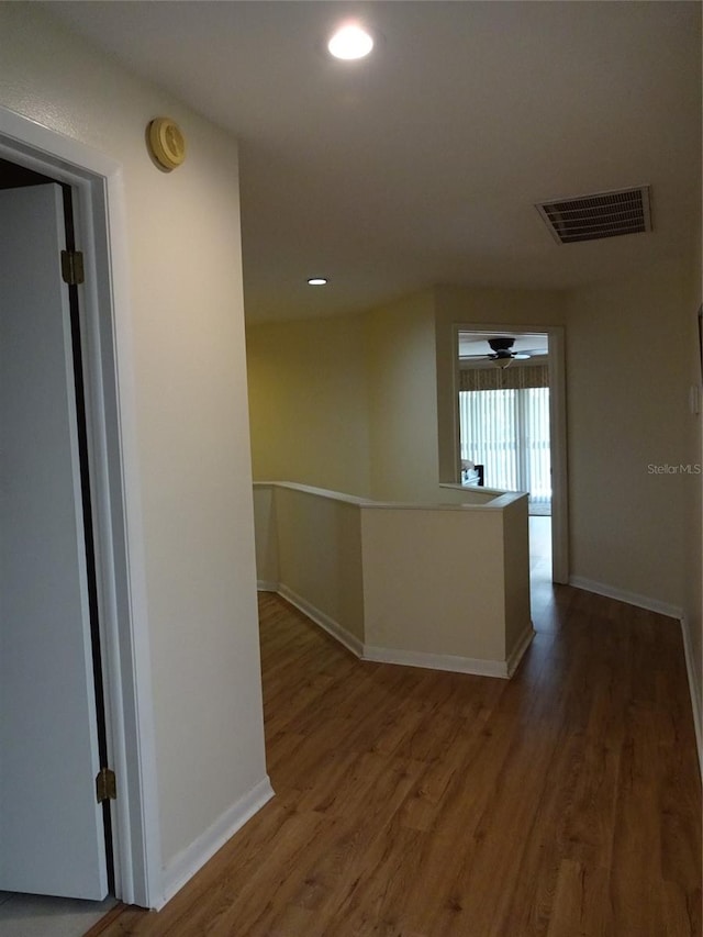 corridor featuring dark hardwood / wood-style floors