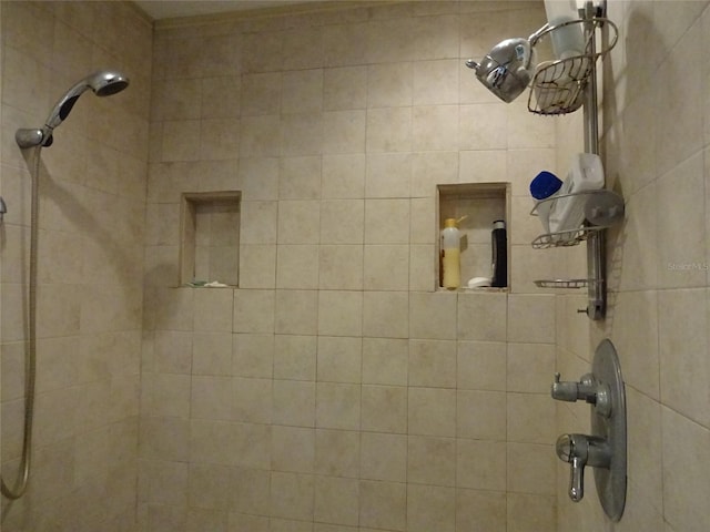 bathroom with tiled shower