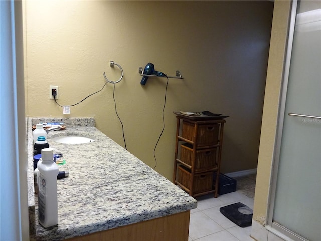 bathroom featuring vanity, tile patterned floors, and an enclosed shower