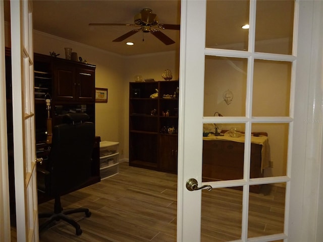 home office with hardwood / wood-style floors, crown molding, and ceiling fan