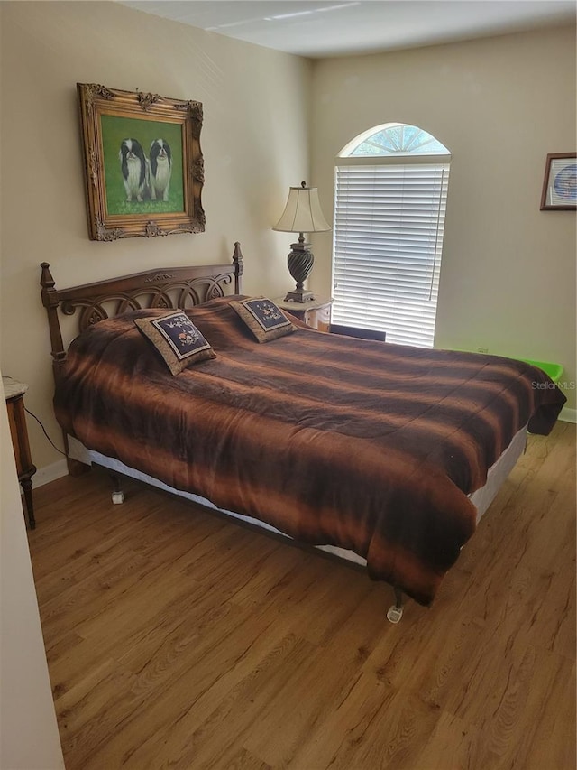 bedroom featuring hardwood / wood-style flooring