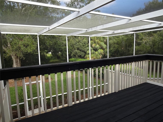 wooden deck featuring a yard