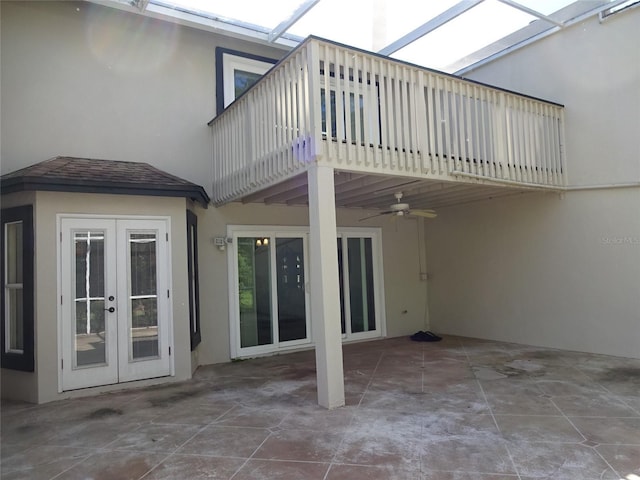 13936 Clubhouse Cir Unit 13936, Tampa, FL 33618 - back of property with stucco siding, ceiling fan, french doors, and a balcony