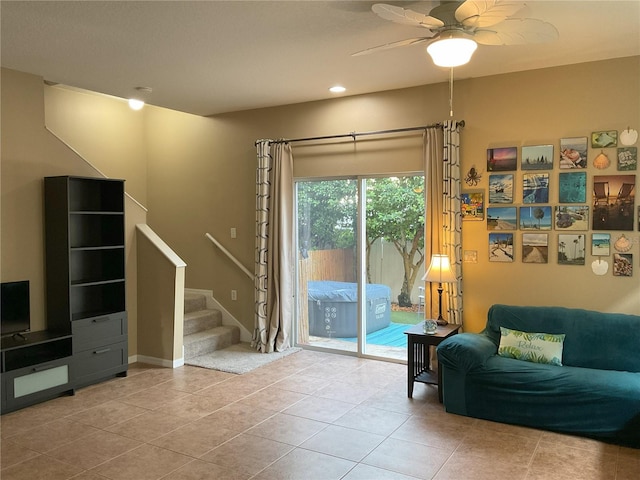 tiled living room with ceiling fan