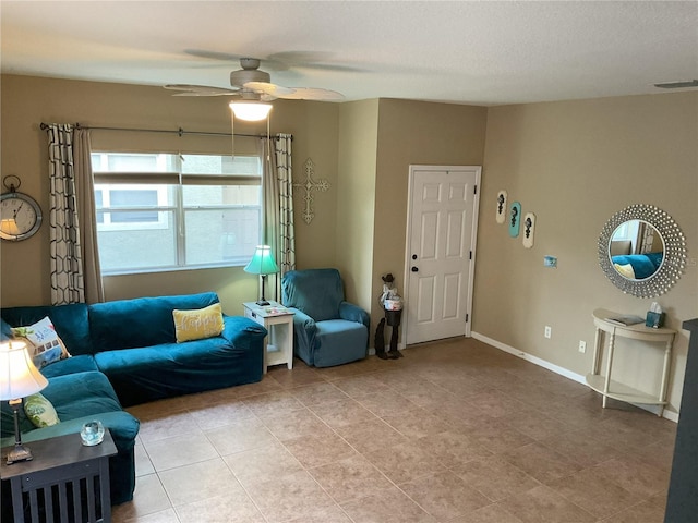 living room with ceiling fan and light tile patterned flooring