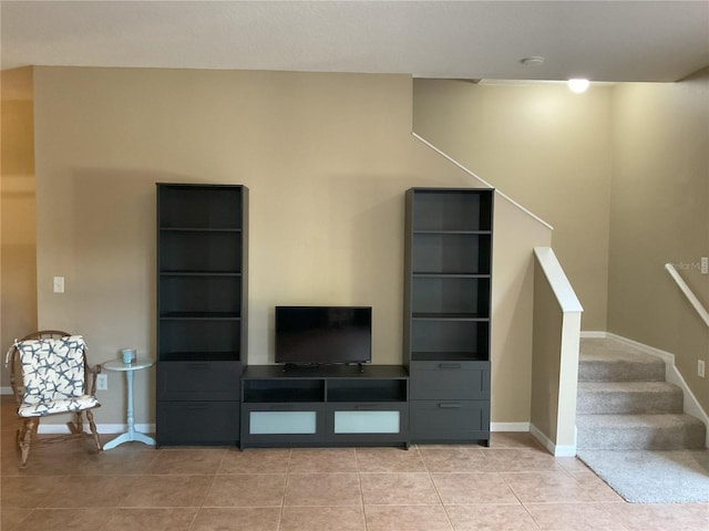 unfurnished living room with light tile patterned floors