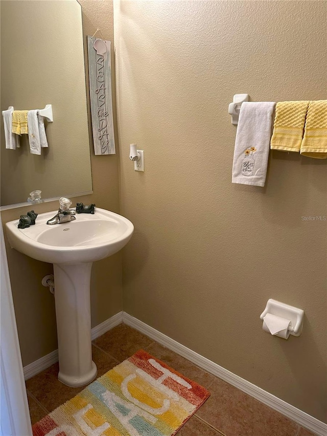 bathroom with tile patterned floors