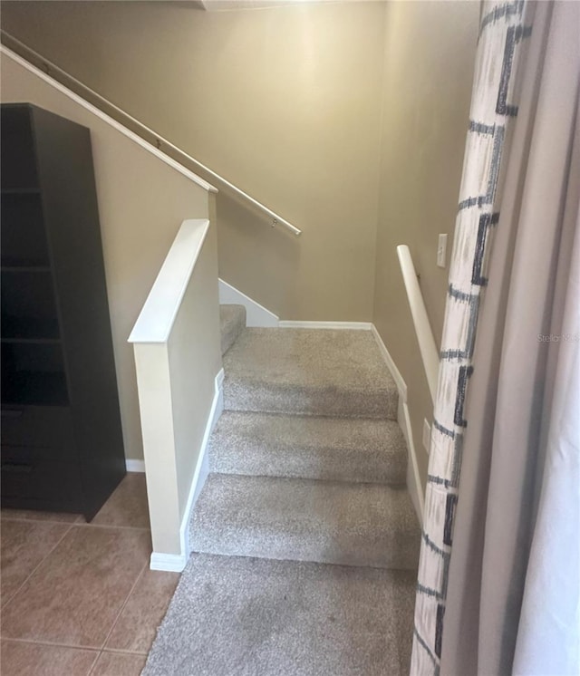 stairs with tile patterned floors