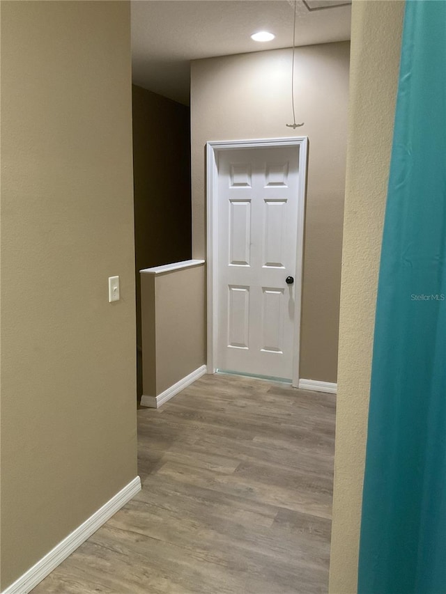 hallway featuring light hardwood / wood-style floors