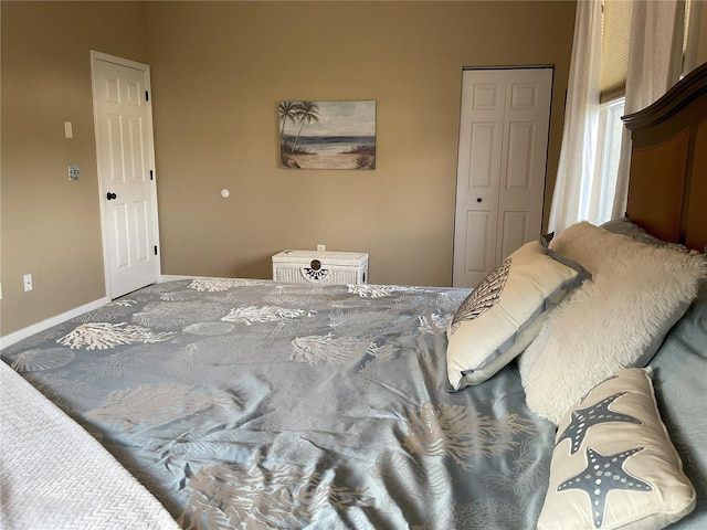 bedroom featuring a closet and carpet flooring