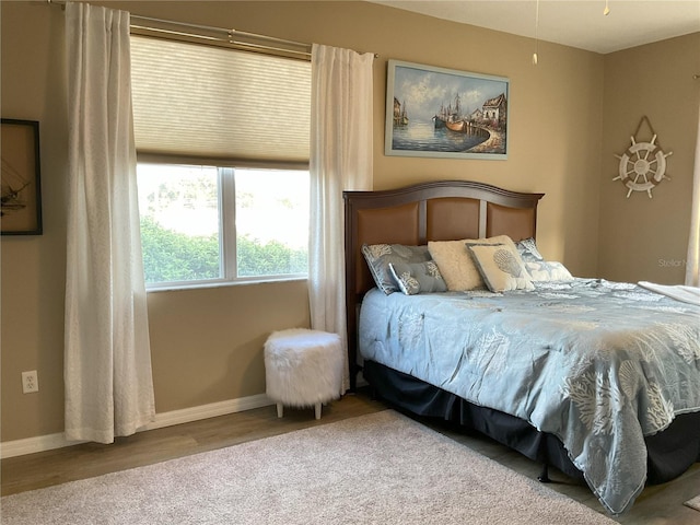 bedroom featuring hardwood / wood-style floors