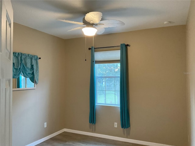 spare room with ceiling fan and hardwood / wood-style floors